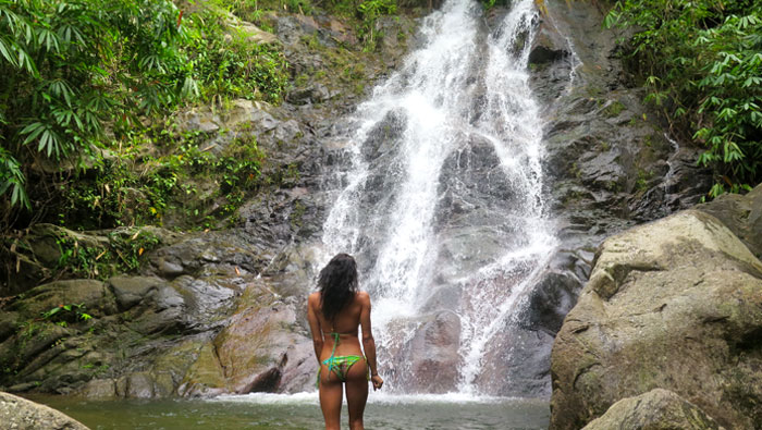 woman looking at waterfall