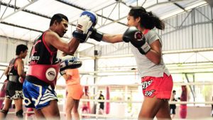 father and daughter training muay thai