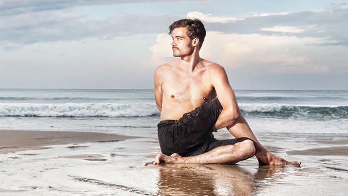 yoga pose in the beach