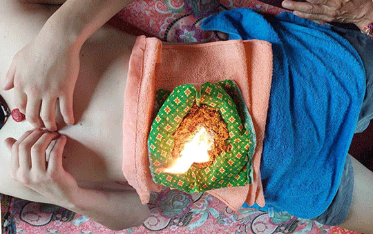 burning herb massage